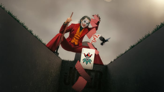 Joker playing cards and a bird
