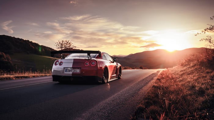 Nissan GTR sports car on a road at sunset