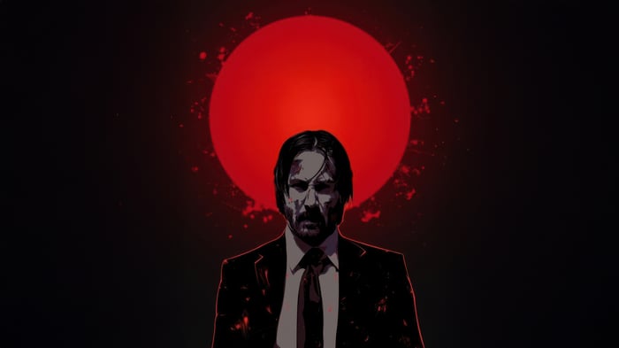 John Wick in front of a red sun