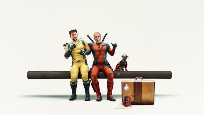 Deadpool and Wolverine sitting with a dog and luggage