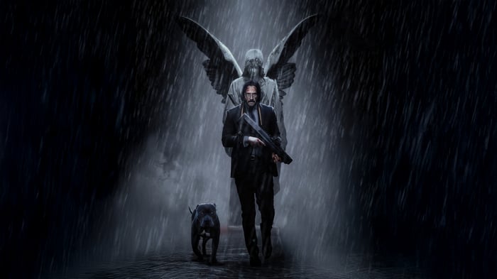 John Wick and his dog with an angel statue