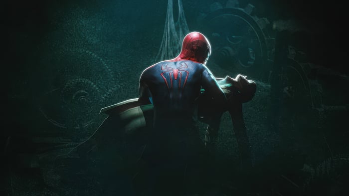 Spider-Man holding a fallen figure