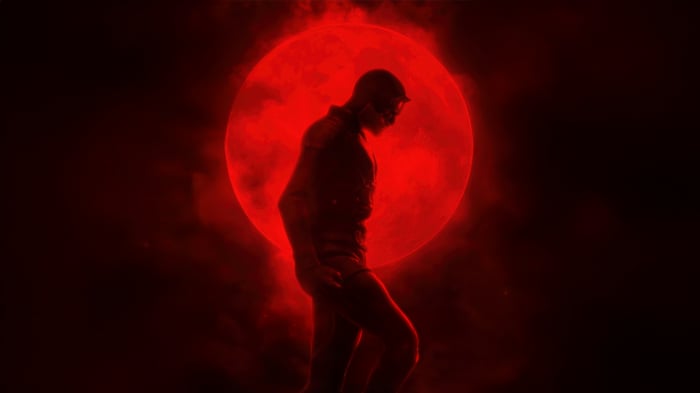 Daredevil in front of a red moon