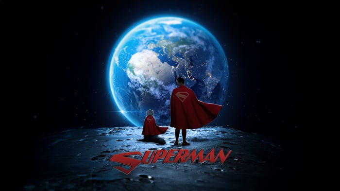 Superman and child on the moon looking at Earth