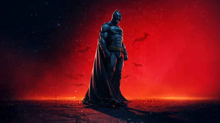 Batman Standing in Front of Red Background with Bats