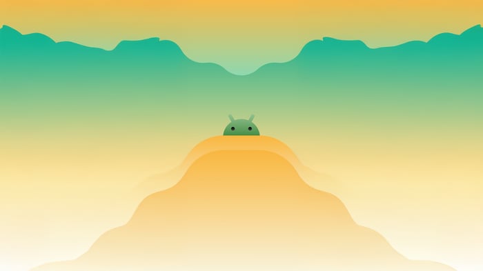 Android Robot Peeking Over Orange Hills