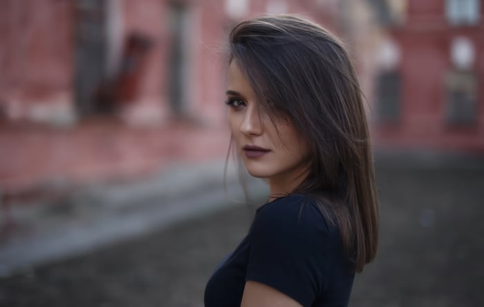 Woman looking over her shoulder in modern street photography