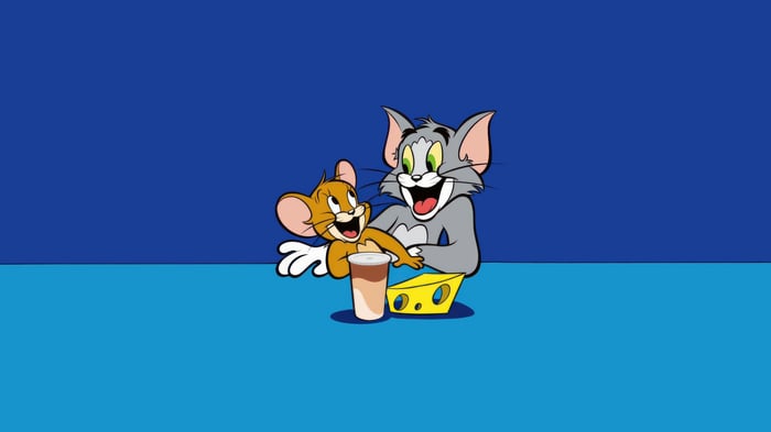 Tom and Jerry with a drink and cheese