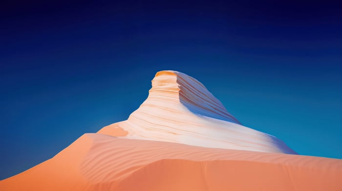 White Sandstone Rock Formation Against Blue Sky