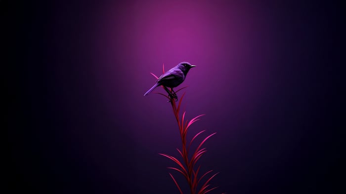 A purple bird sits on a red plant