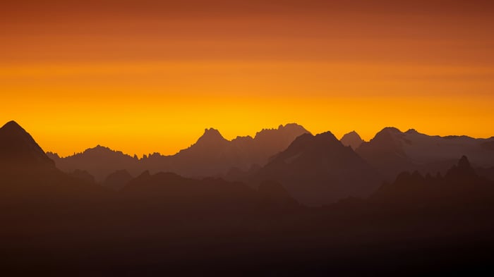 Sunset over a silhouetted mountain range