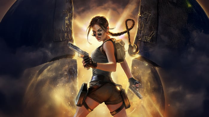 Lara Croft holding pistols in front of ancient stone structures