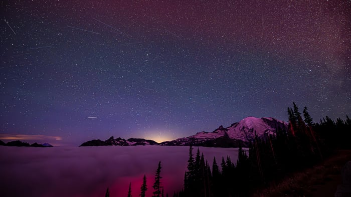 Meteor Shower Over Mountains Above Clouds