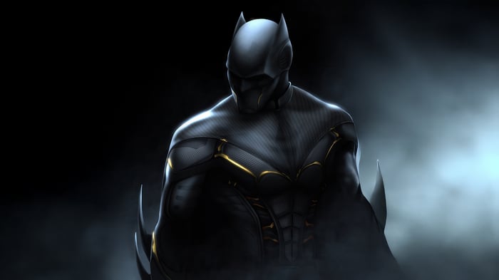 Batman in a dark, futuristic suit with gold accents