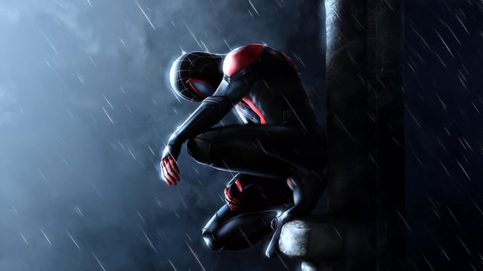 Spider-Man crouching in the rain