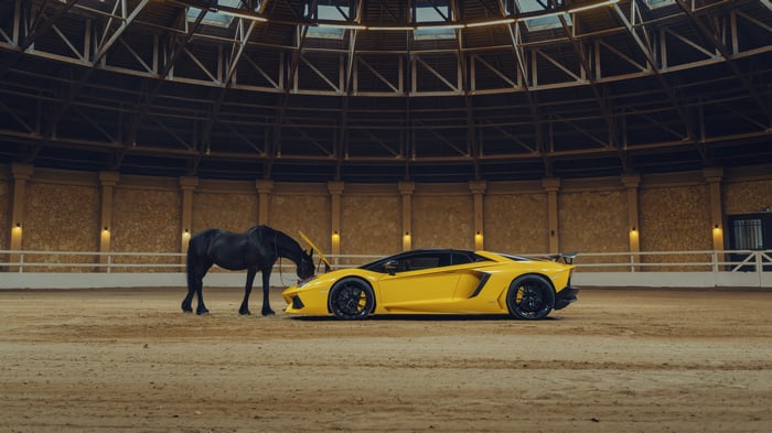 Black Horse and Yellow Lamborghini Aventador in Arena