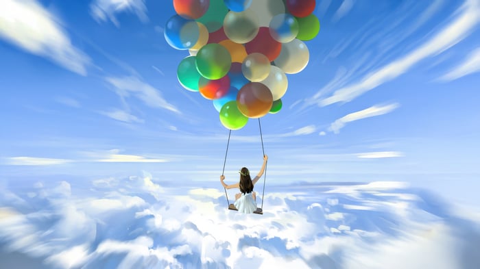Girl on Swing Held by Balloons in the Sky