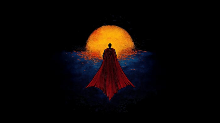Superman standing in front of a large orange sun