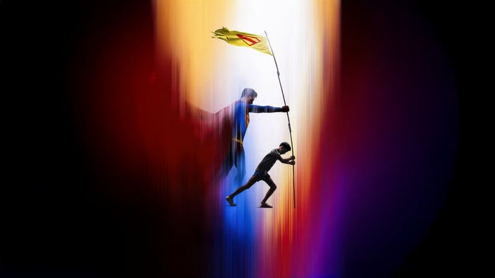 Superman holding a flag with a boy pushing a pole