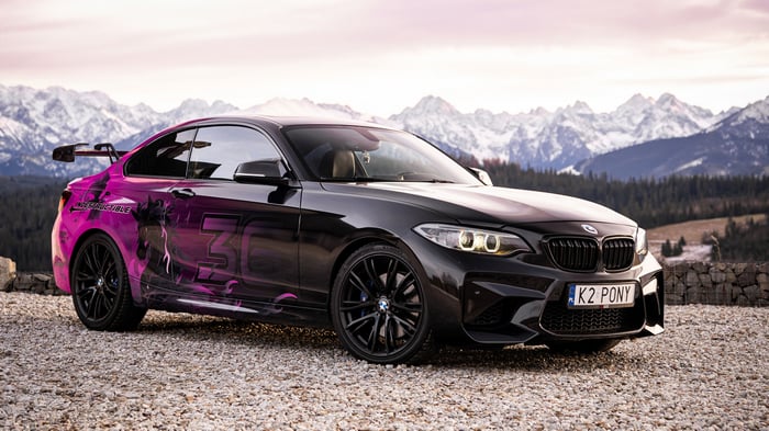 BMW M2 with custom graphics in mountains