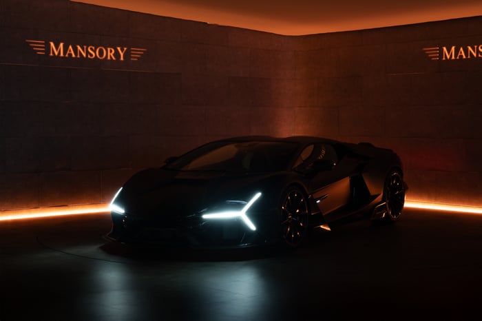 Mansory Initiate supercar in a dark studio