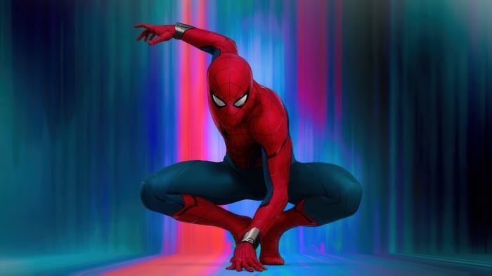 Spider-Man crouching against a colorful, blurred background