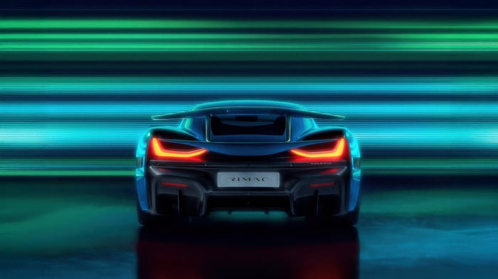 Rimac Nevera rear view with neon background