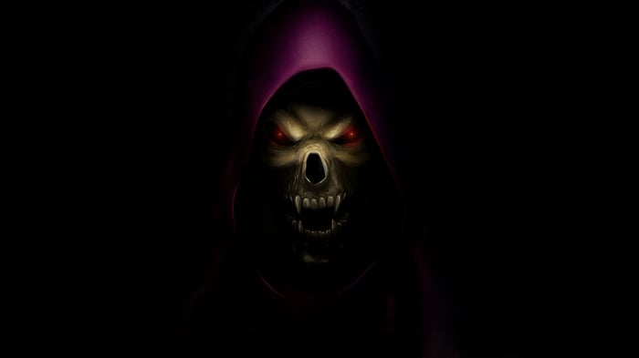 Skeletor with glowing red eyes and fangs