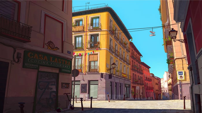 A street corner in Madrid with buildings and a restaurant