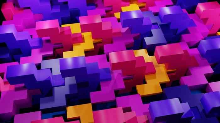 Colorful 3D geometric blocks arranged in a pattern