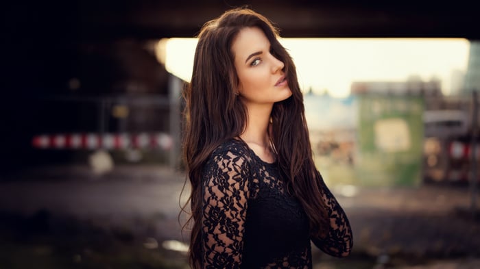 Girl in black lace top outdoors