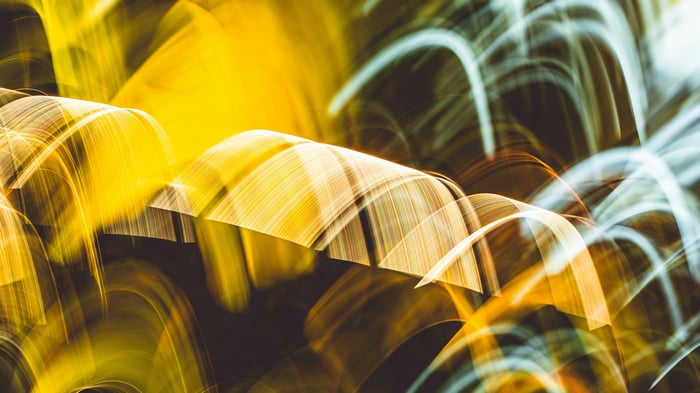 Abstract swirls of yellow and white light