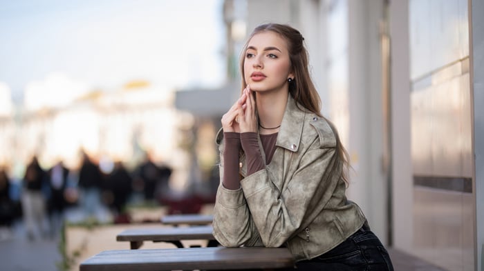 Girl relaxing outside a coffee cafe