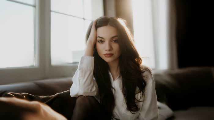 Lauren Lavera sitting on a couch