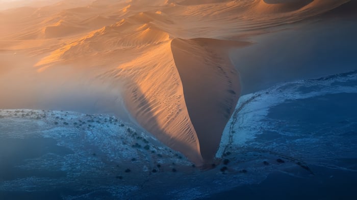 Aerial view of sand dunes at sunrise