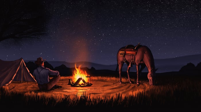 Cowboy Sitting By Campfire With Horse Under Starry Night