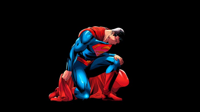 Superman Kneeling on Black Background