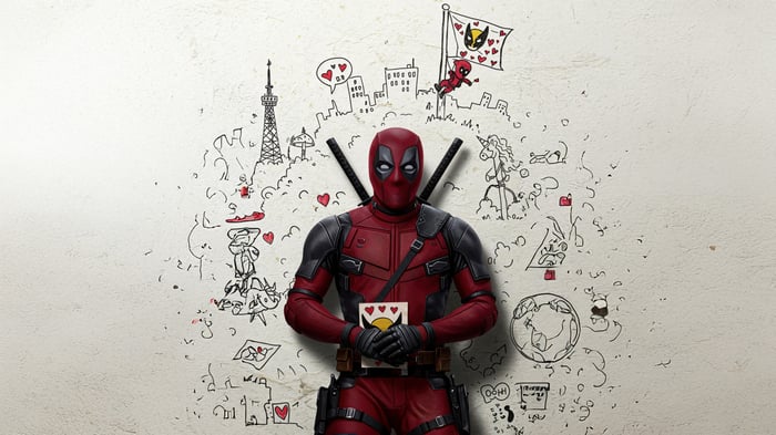 Deadpool holding a card with hearts