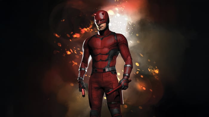 Daredevil in his red suit with nunchucks