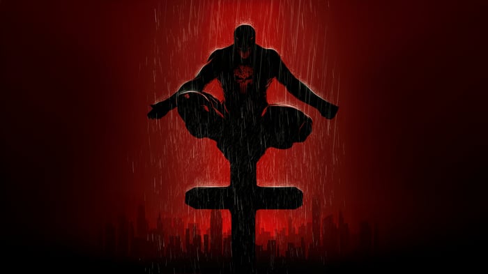 Daredevil sitting on a cross in the rain