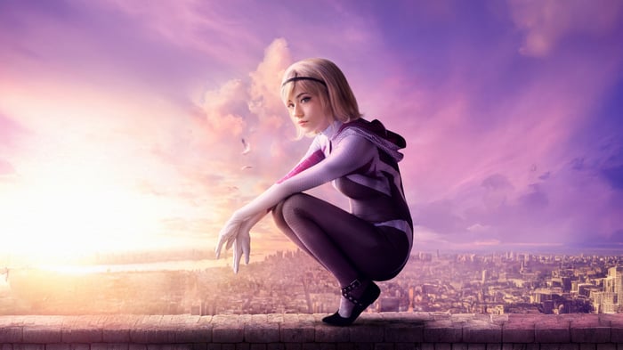 Gwen Stacy posing on a rooftop at sunset