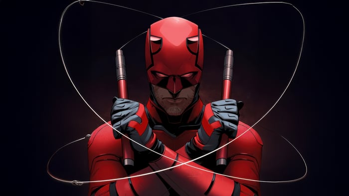 Daredevil holding billy clubs with wires