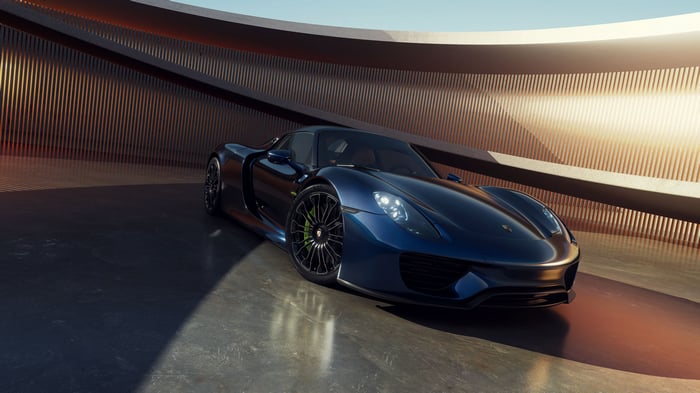 Blue Porsche 918 Spyder in a modern showroom