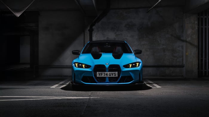 Blue BMW M4 parked in a garage