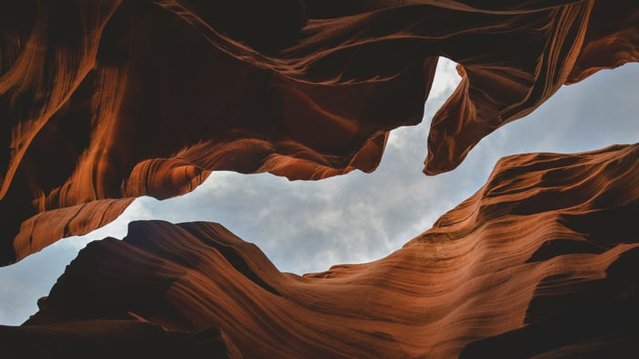 Antelope Canyon rock formations against cloudy sky