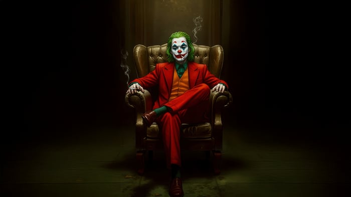 Joker sitting in a chair smoking