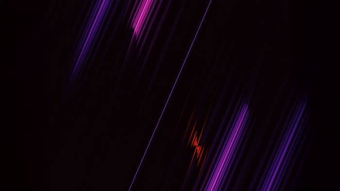 Purple and orange light streaks on black