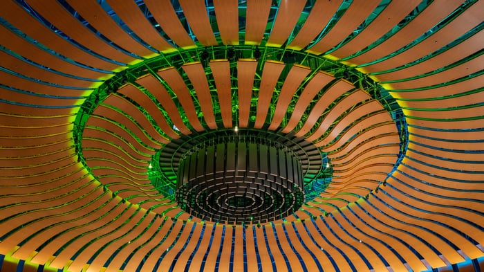 Wooden slats with green glow on ceiling
