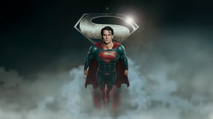 Superman flying with the S-shield logo