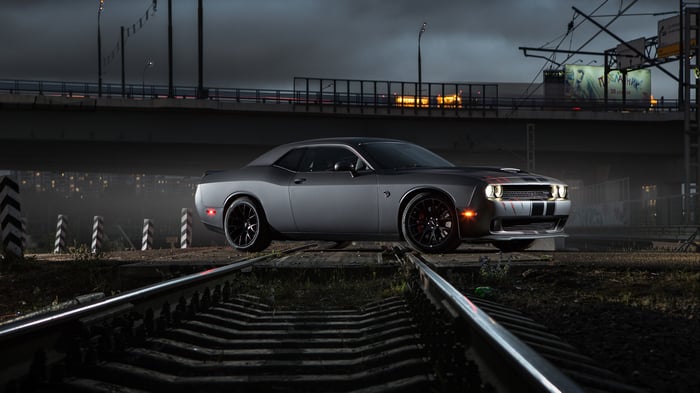 Dodge Challenger Hellcat on train tracks at night